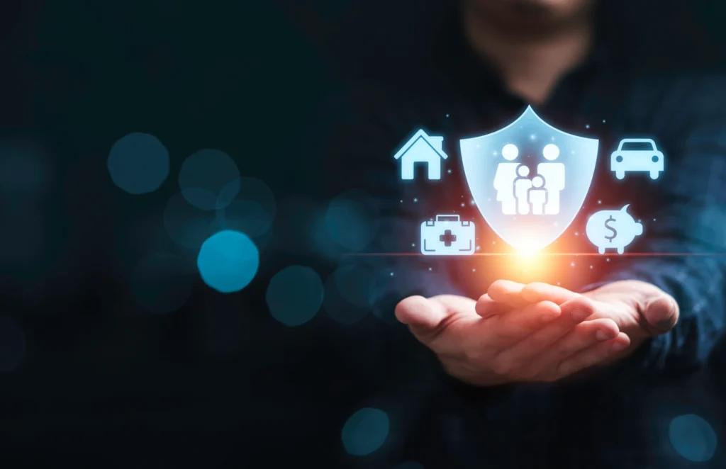 Businessman holding and giving insurance and assurance icon including family health real estate car and financial for risk management