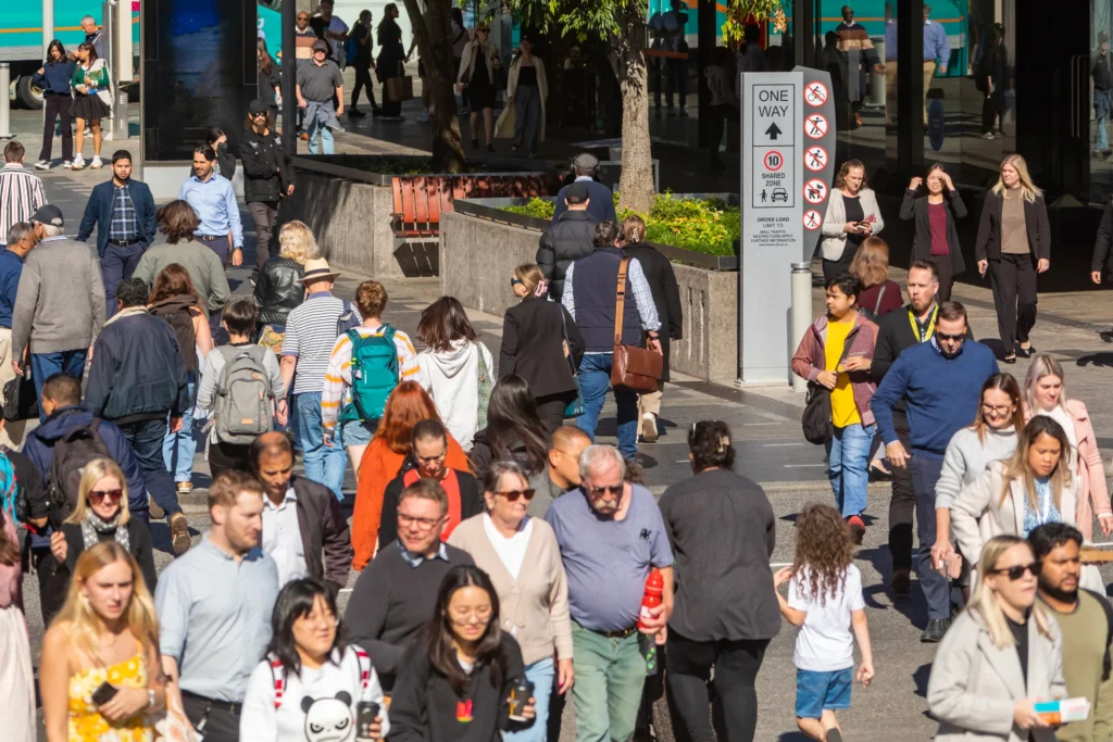 Crowd of commuters crossing a street