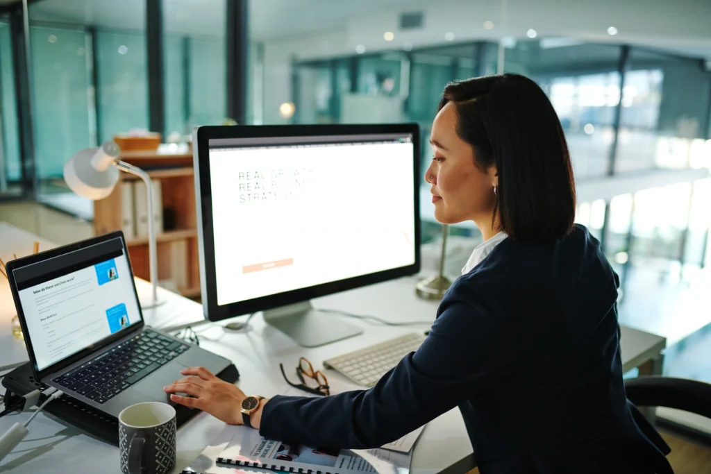 businesswoman using a computer in a modern office at work